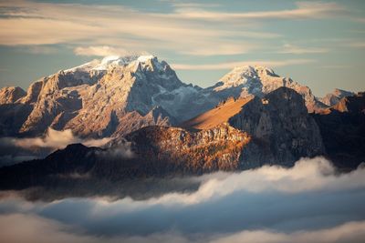 Scenic view of snowcapped mountains against sky during sunset