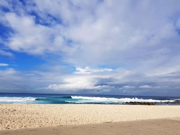 Scenic view of beach against sky