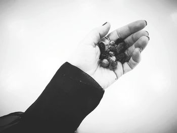 Close-up of person hand against white background