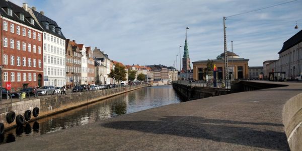 Canal passing through city buildings