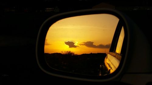 Reflection of sky on side-view mirror