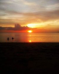 Scenic view of sea at sunset