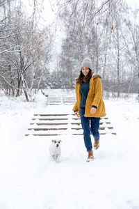 Man with dog in snow