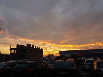 Cars in parking lot at sunset