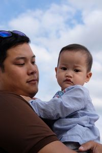 Portrait of cute mother and daughter outdoors
