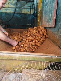 Man preparing food at market stall