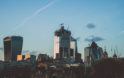 Modern buildings in city against sky