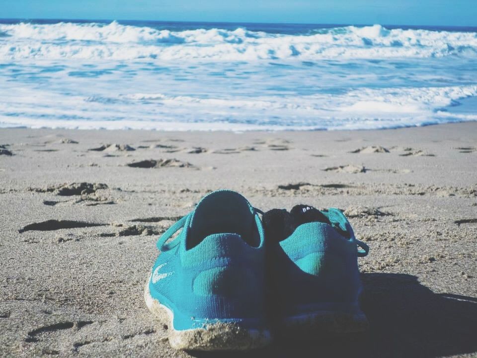 beach, sand, sea, shore, water, horizon over water, tranquility, nature, blue, relaxation, beauty in nature, tranquil scene, scenics, day, outdoors, sunlight, sky, high angle view, vacations, one person