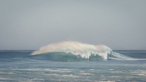 Sea waves against clear sky