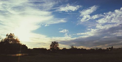 Scenic view of landscape against cloudy sky