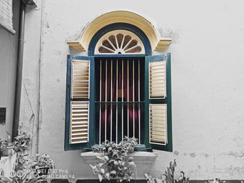 Low angle view of closed window on building