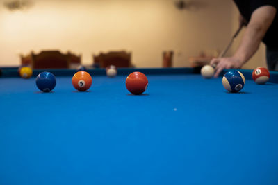 Cropped hand playing pool