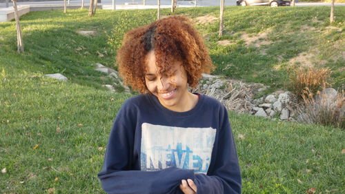 Portrait of young woman in grass