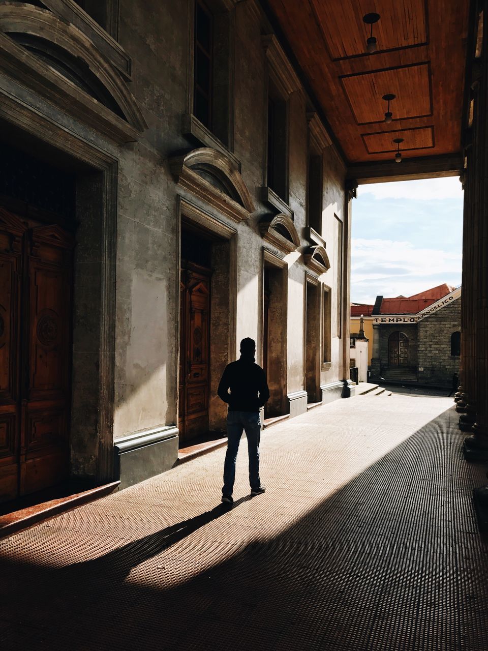 rear view, full length, built structure, architecture, one person, real people, silhouette, men, people, day, only men, indoors, adult, adults only, one man only