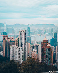 Modern buildings in city against sky