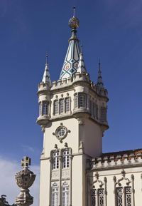 Low angle view of a building against blue sky