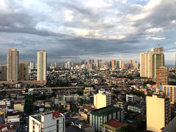 High angle view of modern buildings in city against sky