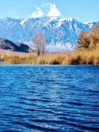 Scenic view of snowcapped mountains against sky