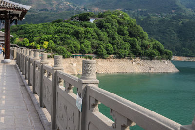 Scenic view of sea by mountain