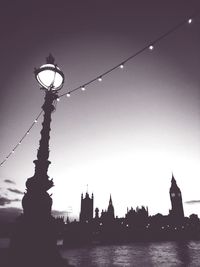 Low angle view of illuminated city against sky