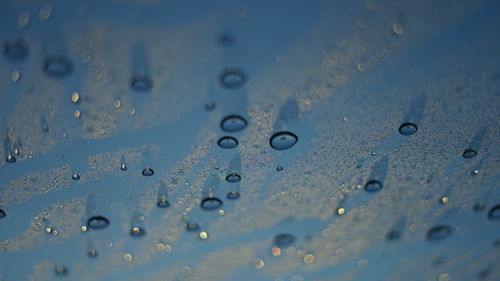 Full frame shot of wet glass window