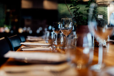 Luxury table settings for fine dining with and glassware, beautiful blurred background. 