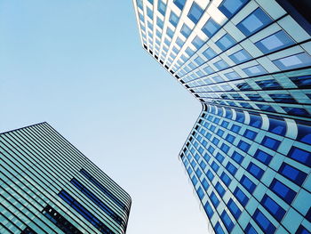 Low angle view of modern buildings against clear sky