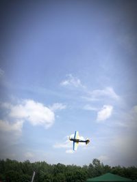 Low angle view of airplane flying in sky