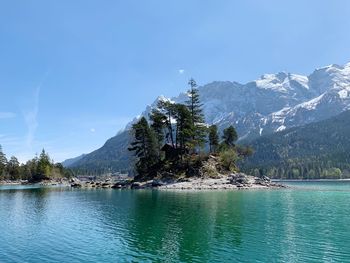 Scenic view of lake against blue sky