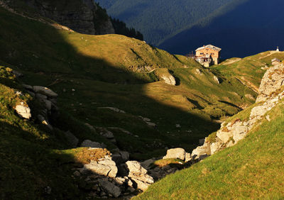 House on mountain at bucegi natural park during sunny day