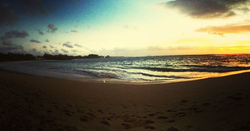 Scenic view of beach against sky