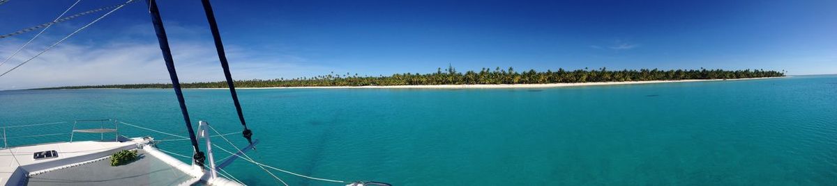 Panoramic view of sea against blue sky