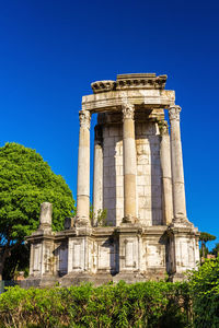 Low angle view of historical building against blue sky