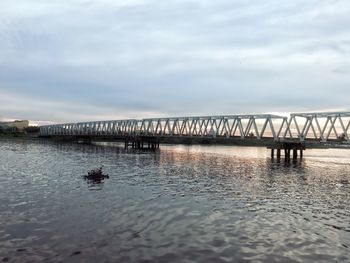 Pier over sea against sky