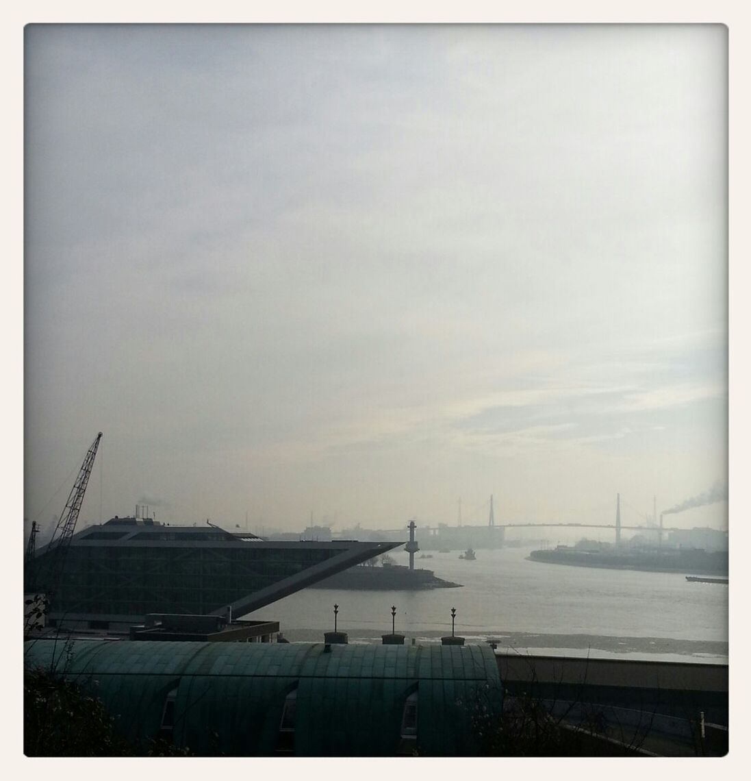 SAILBOATS IN SEA AGAINST SKY IN CITY