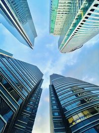 Low angle view of modern buildings against sky