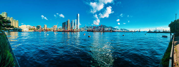 Panoramic view of bay against blue sky