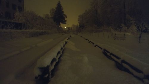 Road amidst trees against sky