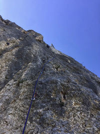 Low angle view of rock formation against sky