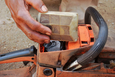 High angle view of man working on machinery