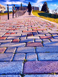 Full length of woman standing on footpath