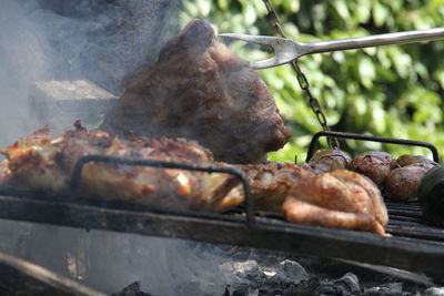 Close-up of meat on barbecue grill