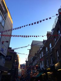 Low angle view of buildings against clear sky