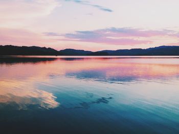 Scenic view of lake at sunset