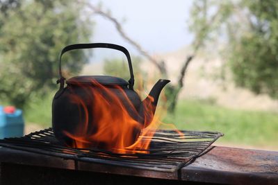 Close-up of burning tea kettle