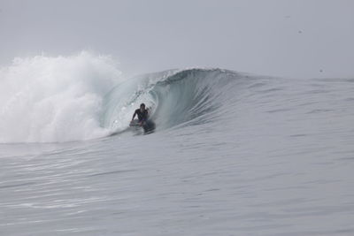 Man surfing on sea