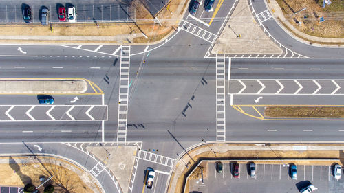 Aerial view of car parked at parking lot by road