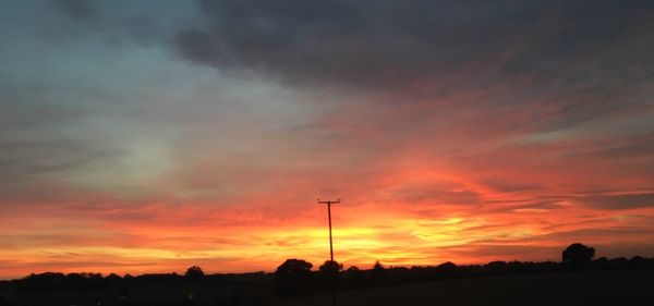 Low angle view of dramatic sky during sunset