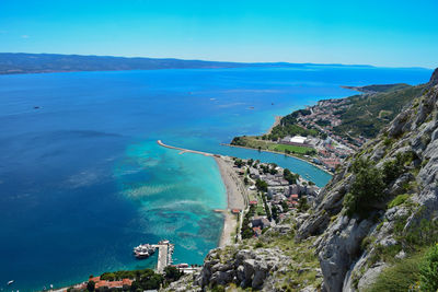 High angle view of sea against blue sky