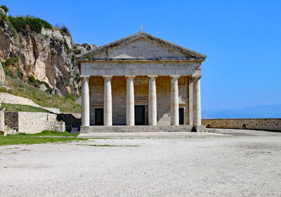 Exterior of old building against blue sky